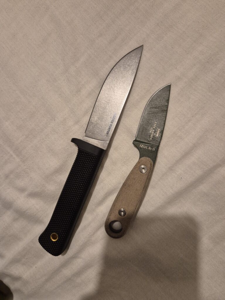 My friend broke my ESEE 4 and bought me this 3V Master Hunter...