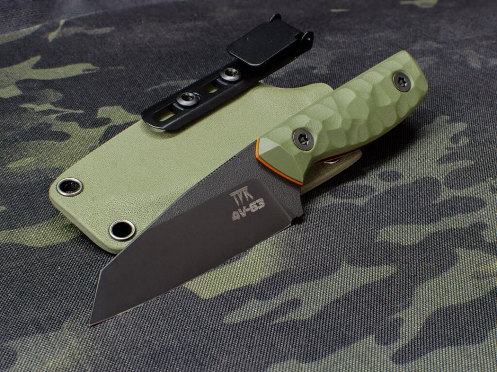 CPM 4V wharncliffe, one of my favourite smaller designs. Black Cerakote, OD G10, orange liners