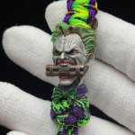 Handcrafted silver Joker bead — getting the dynamite detail to read at bead scale was the real challenge