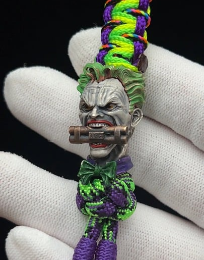 Handcrafted silver Joker bead — getting the dynamite detail to read at bead scale was the real challenge