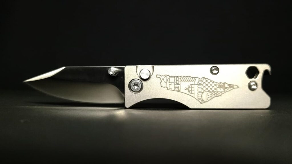 I designed this compact titanium keychain knife. What do you think?