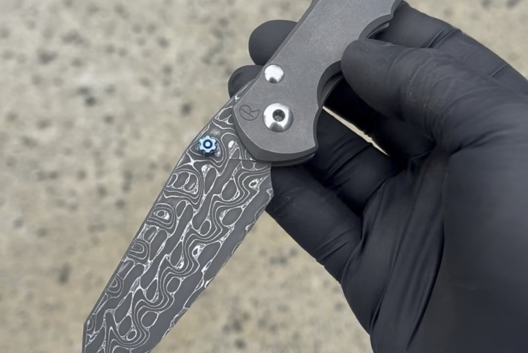 Custom Damascus blade on a CRK Inkosi