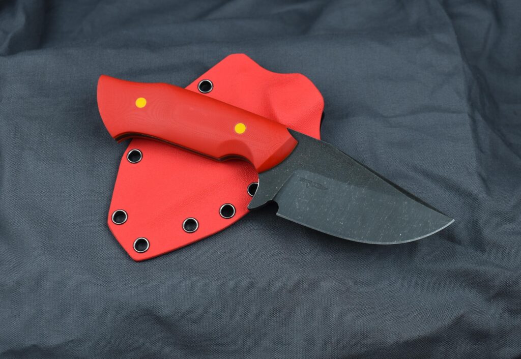 Vanadis 4E at 63HRC, red G10 scales, yellow and orange G10 liners, kydex sheath. What do you think?