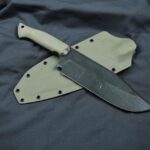 Big Magnacut beast at 62HRC, desert tan G10 scales, cyan liners, toxic green pins and desert tan sheath. What do yall think?