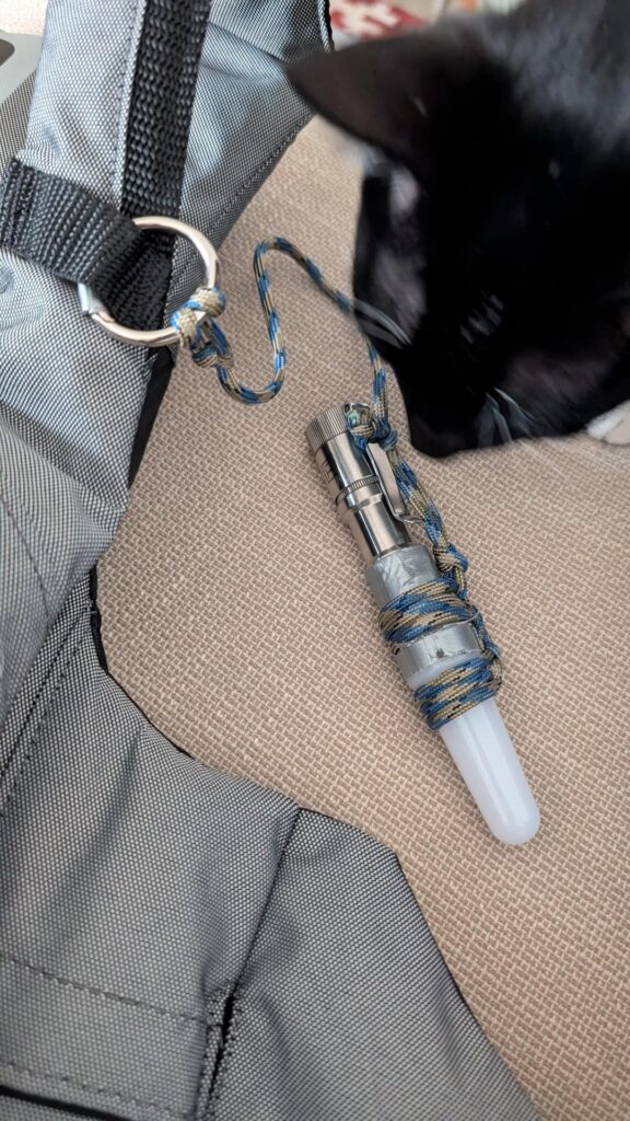 Didn't want to buy a sea beacon, so I repurposed my Manker E-05 II and strapped it to my vest
