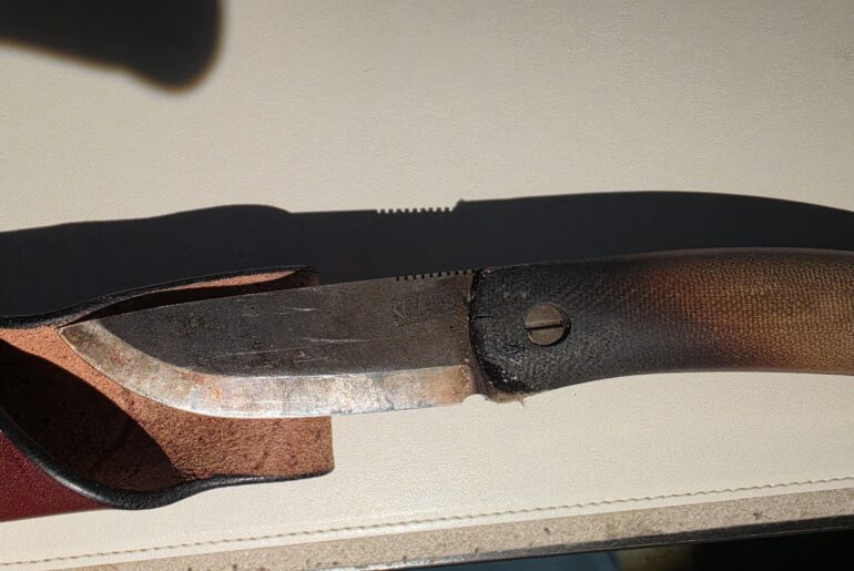 While camping last year, my knife spent the night wedged into a piece of firewood, in the fire.  Will this compromise the blade?  Anything I should do to clean it?