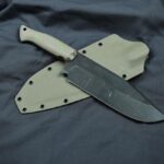 Big Magnacut beast at 62HRC, desert tan G10 scales, cyan liners, toxic green pins and desert tan sheath. What do yall think?