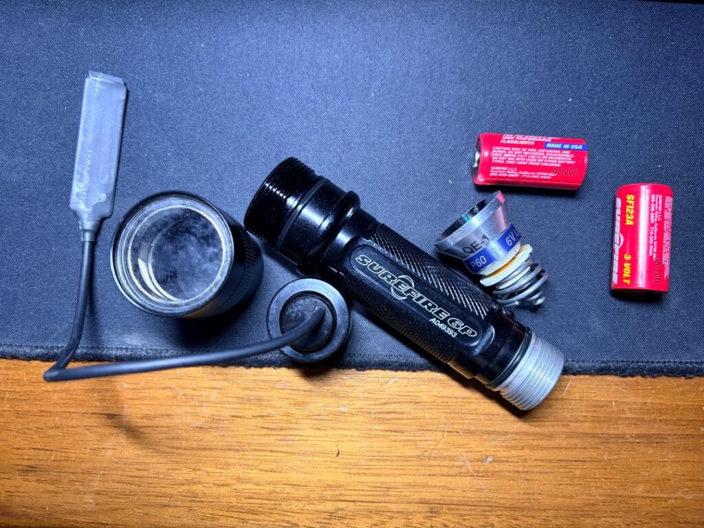 Can anyone help me identify this old surefire?