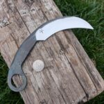Made a karambit from an old half round file. Thought it turned out cool, kinda snake-like.
