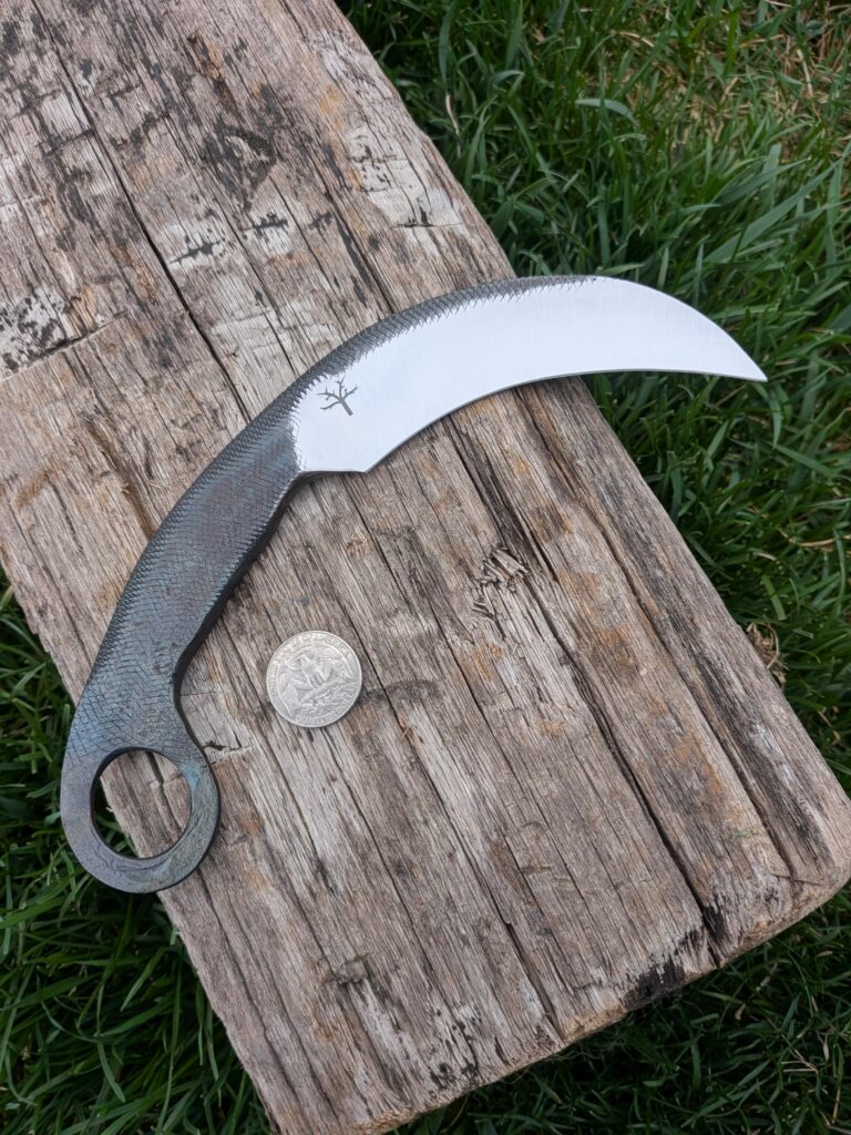 Made a karambit from an old half round file. Thought it turned out cool, kinda snake-like.