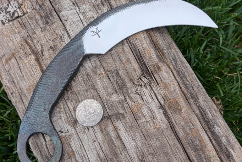 Made a karambit from an old half round file. Thought it turned out cool, kinda snake-like.