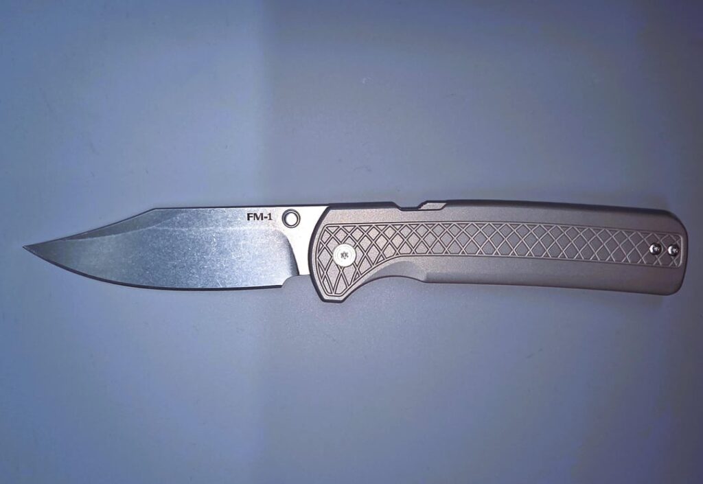 New Cold Steel FM-1 with Clip Point blade. Exactly as the original Drop Point one, exact weight and same detent/lock, just a different blade. (Original FM-1 and a Batarang for scale)