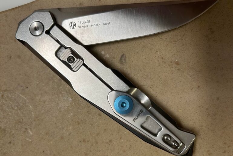 Favorite silver color-titanium/stainless scaled flipper knife? Pics? Looking for a few extra besides these I got. JW not a fan of the Pyrite or Leek. Love my P108 (smooth flip) but want higher end blade steel.