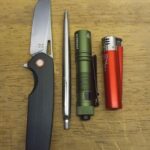 I skipped the notebook for a better flashlight and lighter!