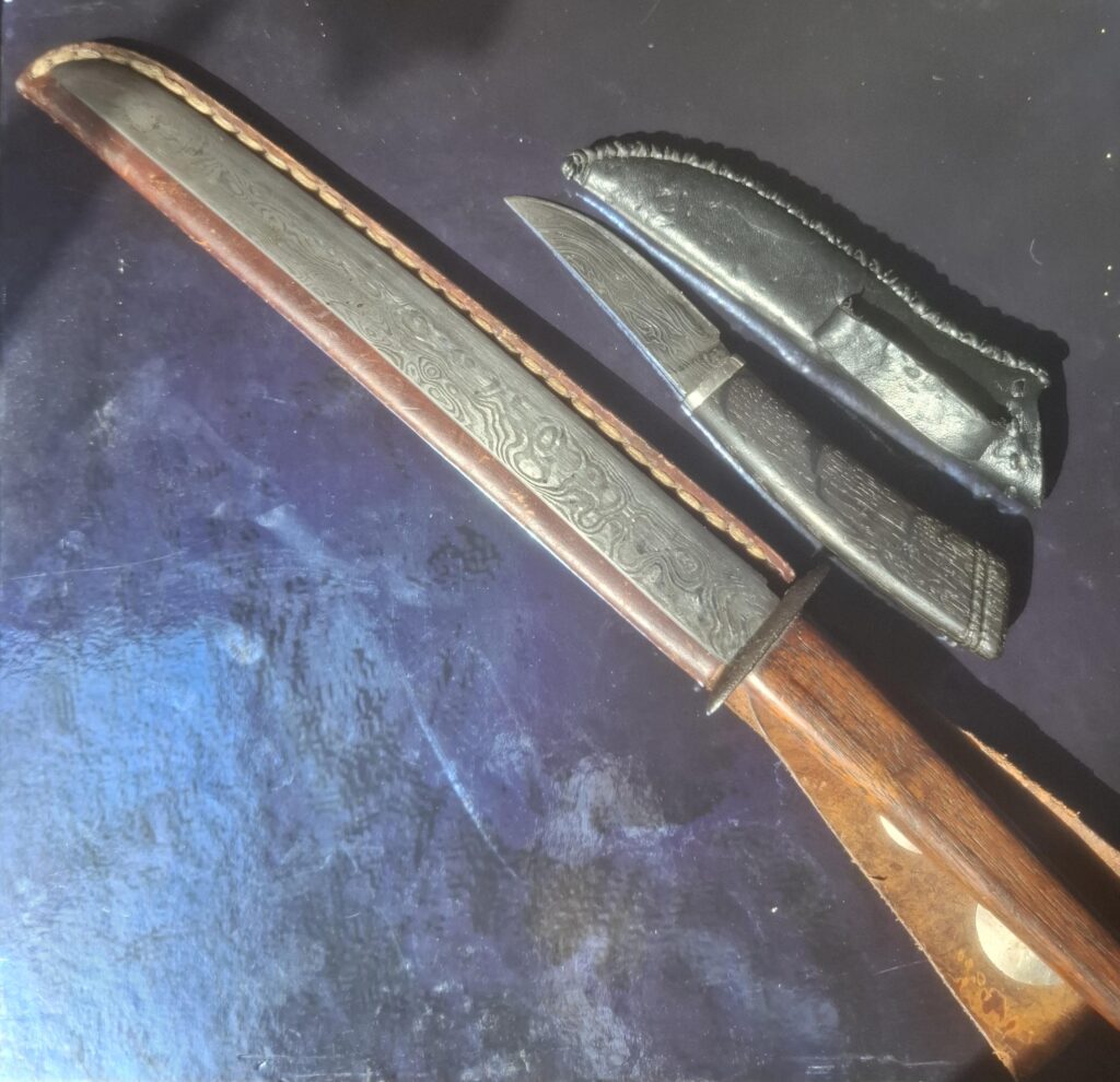 Hand forged damascus knives by my late father.