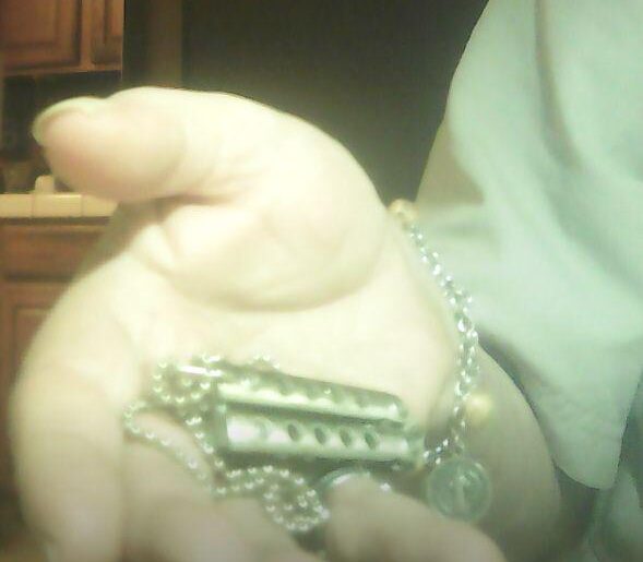 Icetek stainless miniature working balisong. Makes a neat pendant to show off my love of butterfly knives!