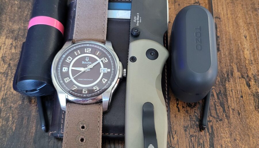 Chillin at the tire shop today. . . Bulova Precisionist. . . Oakley Prescription glasses. . . Tozo headphones. . . POM spray. . . Kizer Drop Bear 2 knife. . . Walleteras wallet