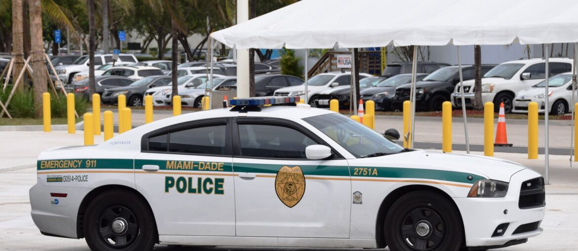 White and green Miami-Dade police Dodge Charger