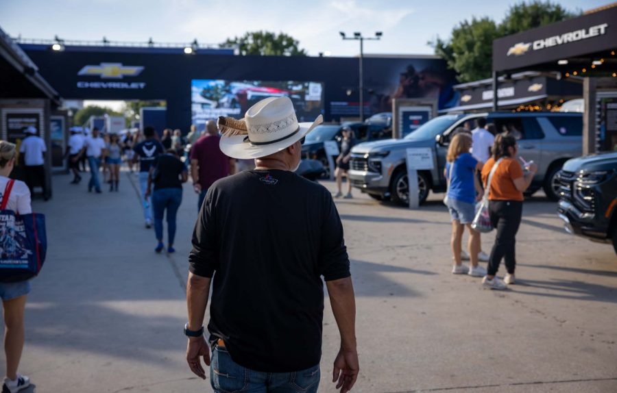 People walking amonst GM vehicles at the State Fair of Texas