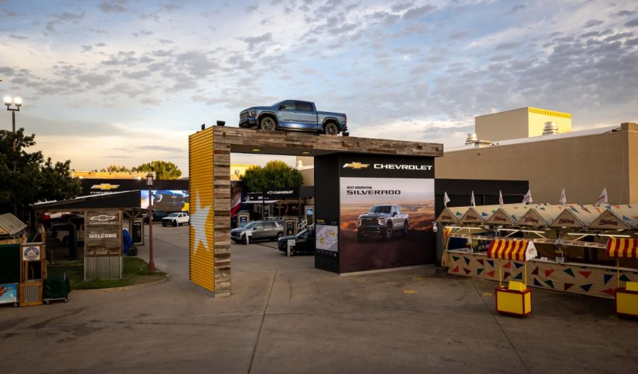 Blue 2027 Chevrolet Silverado atop enterance to State Fair of Texas